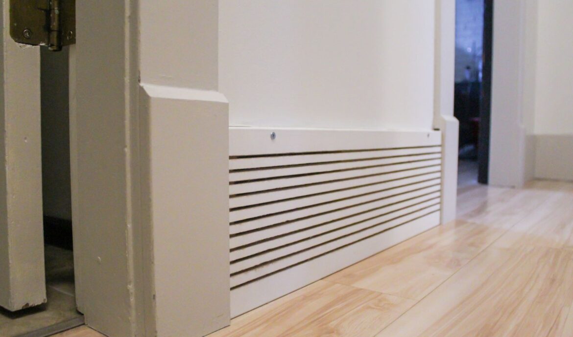 A cold air vent, made from trim, with vertical slats.
