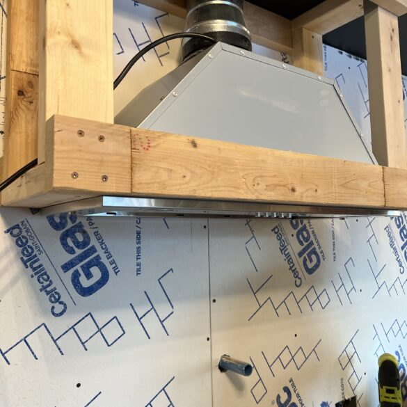 hood vent installed into 2x4 framing onto a wall 